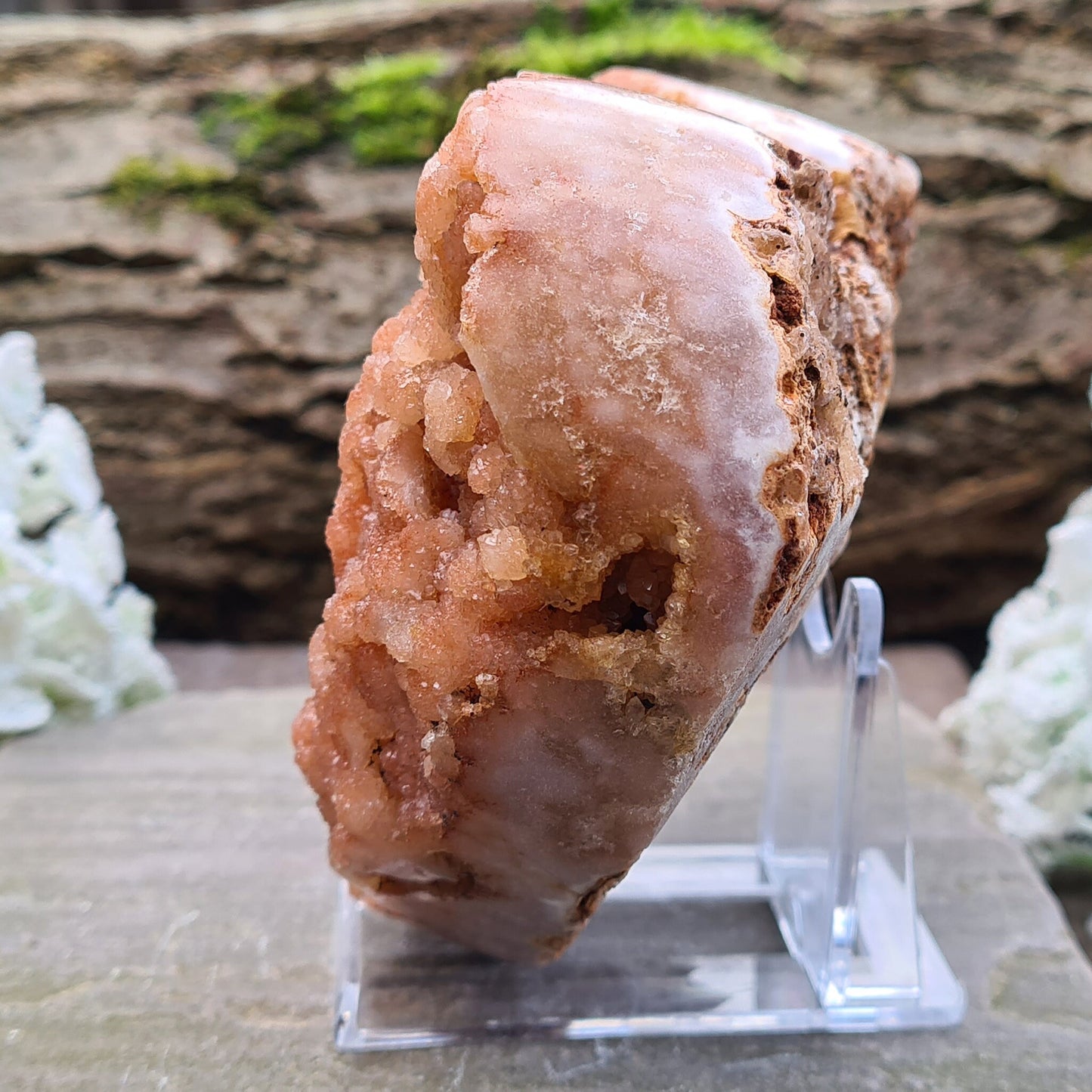 This striking Red Amethyst Heart showcases natural druzy crystal formations in shades of dusky pink/red. Its polished sides and natural base allow it to sit flat, while the included stand lets you display it upright as a beautiful statement piece.