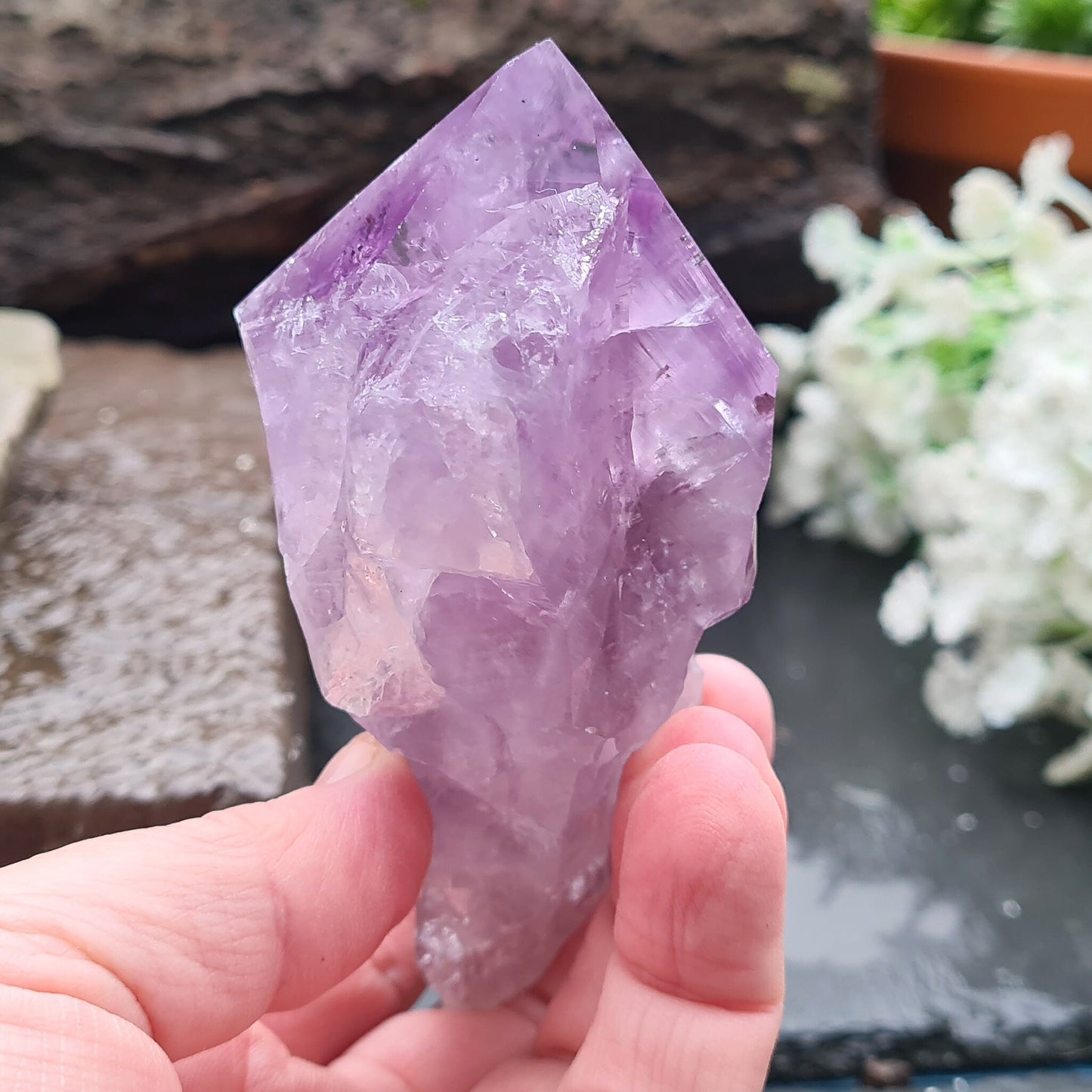 Brazilian Amethyst Crystal Point with dark purple color, polished tip, and natural body, also known as Amethyst Root.