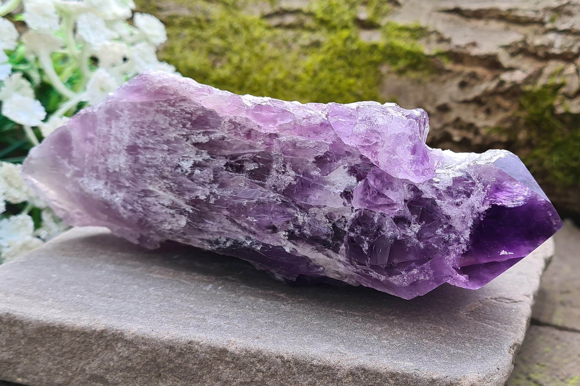 Elestial Amethyst from Brazil with layered formations and a natural point — deep spiritual insight, emotional healing, and peaceful energy.