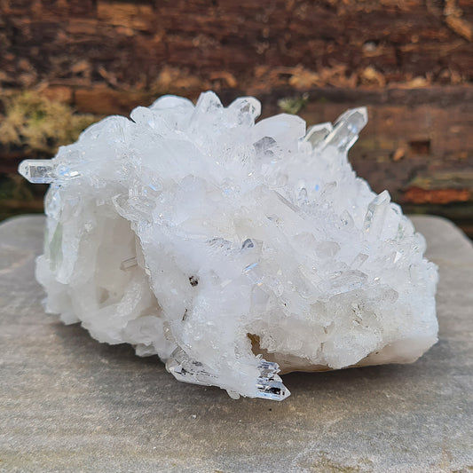 Natural Quartz Cluster from Brazil, AA Grade. This cluster has so many crystal clear quartz points on it, it just sparkles and twinkles in the light. The cluster also has some crystal clear double terminated points. 
