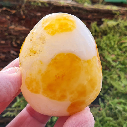 Carnelian Crystal, Pebble Shaped. From Madagascar. This pebble has wonderful pale orangey yellow and white patterning, the white comes from the white microcrystalline quartz. Very unique piece.