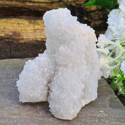 Stalactite Quartz from India. This one looks like it has a 'sugar coating of sparkling quartz crystals. Stalactites are created when mineral rich water drips from the ceiling of a cave to create hanging crystal formations.