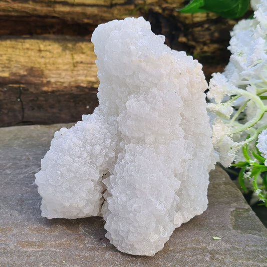 Stalactite Quartz from Madhya Pradesh, India, features a beautiful "sugar coating" of sparkling quartz crystals that catch the light and shimmer. 