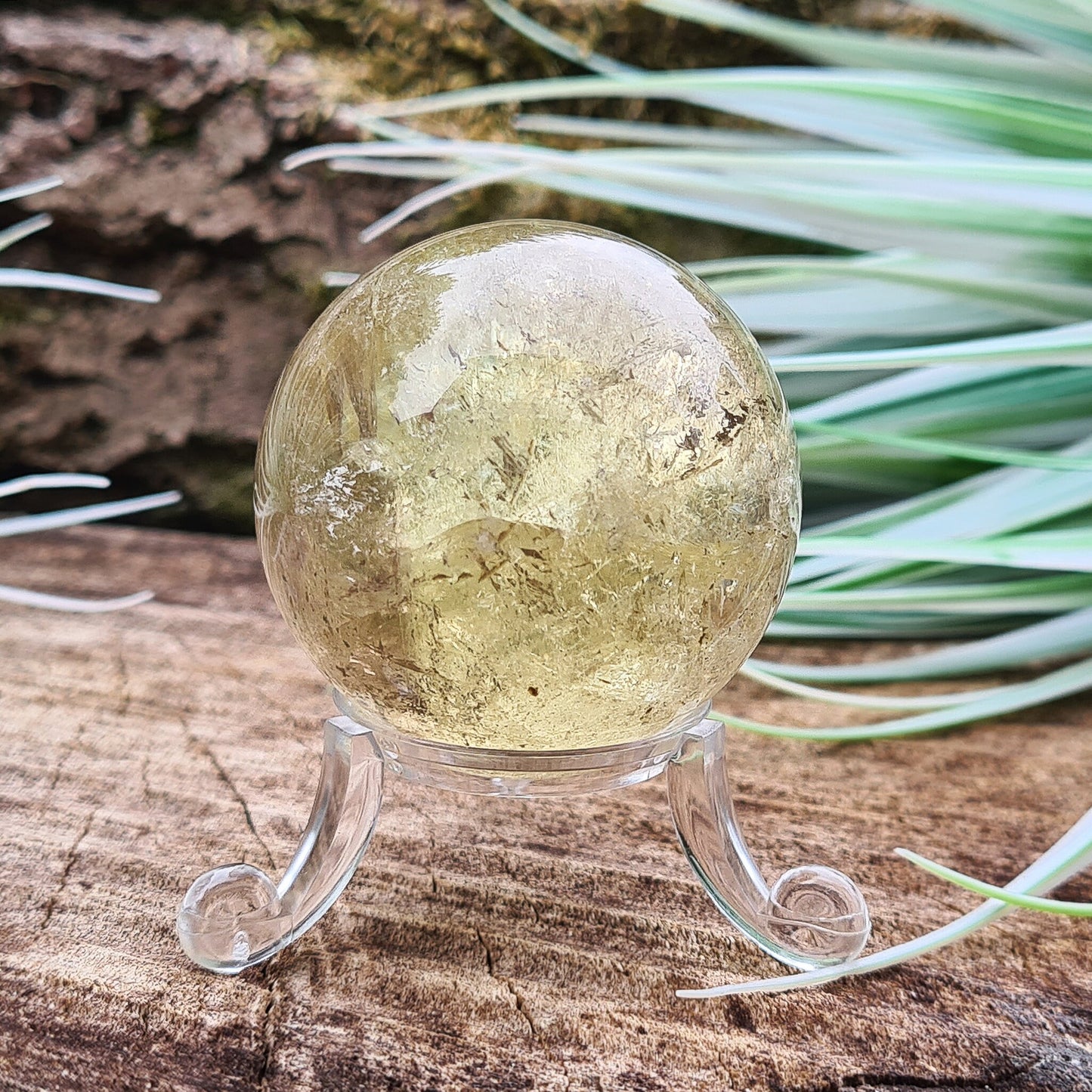 Smoky Quartz Sphere or Crystal Ball. This sphere has light reflecting inclusions and a small area of what I believe to be iron inclusion.