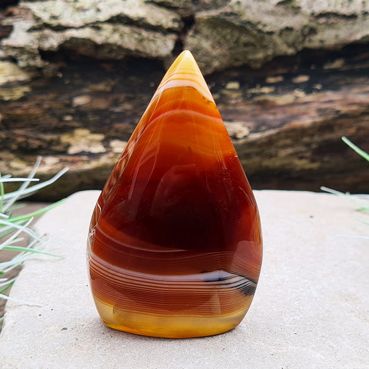 Red Banded Agate Crystal Flame from Brazil, with stunning Red, Orange and White patterning and colouring. Red Agate is very similar to Carnelian but not to be confused with Carnelian. You may see Red Banded Agate being sold as Carnelian.