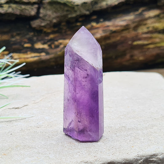 Amethyst Tower from Brazil. This is a great polished crystal with lovely purple colouring and at the top is a very pale lavender/white colouring.