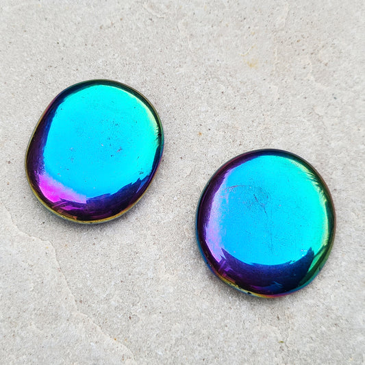 Titanium Aura Obsidian, Rainbow Aura, or known as Mystic Obsidian, Palm Stone.  Aura crystals are created by bonding a precious metal to the surface of a crystal. So the surface of Black Obsidian has been coated with a Titanium Oxide.