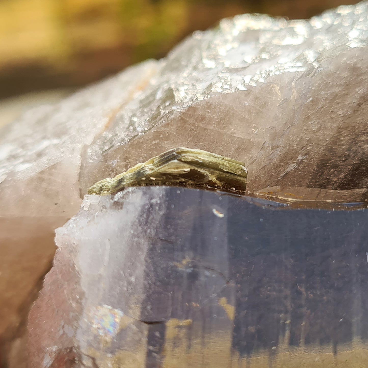 Natural Smoky Quartz Crystal Point From Brazil. This is a fabulous smoky quartz point, with a larger point and smaller point parallel to it. There are also 2 small pieces of green mica and one small piece of lepidolite Mica attached to this magnificent piece.