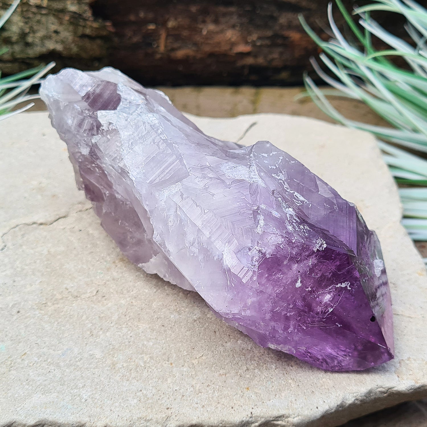 Amethyst Crystal Point from Brazil. A striking piece with deep purple colouring and a polished point. Also known as Amethyst Root.

Measuring 12 cm in length, 6.5 cm in width, and 4 cm in depth, this crystal weighs about 325 grams.