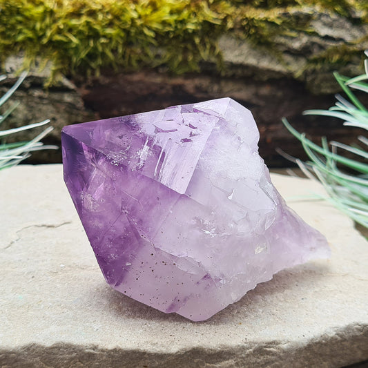 Natural Amethyst Point from Brazil. Has a rainbow in the tip. Fabulous large piece of Amethyst with lovely dark purple colouring, polished point and the rest of the crystal is natural. Also known as an Amethyst Root.