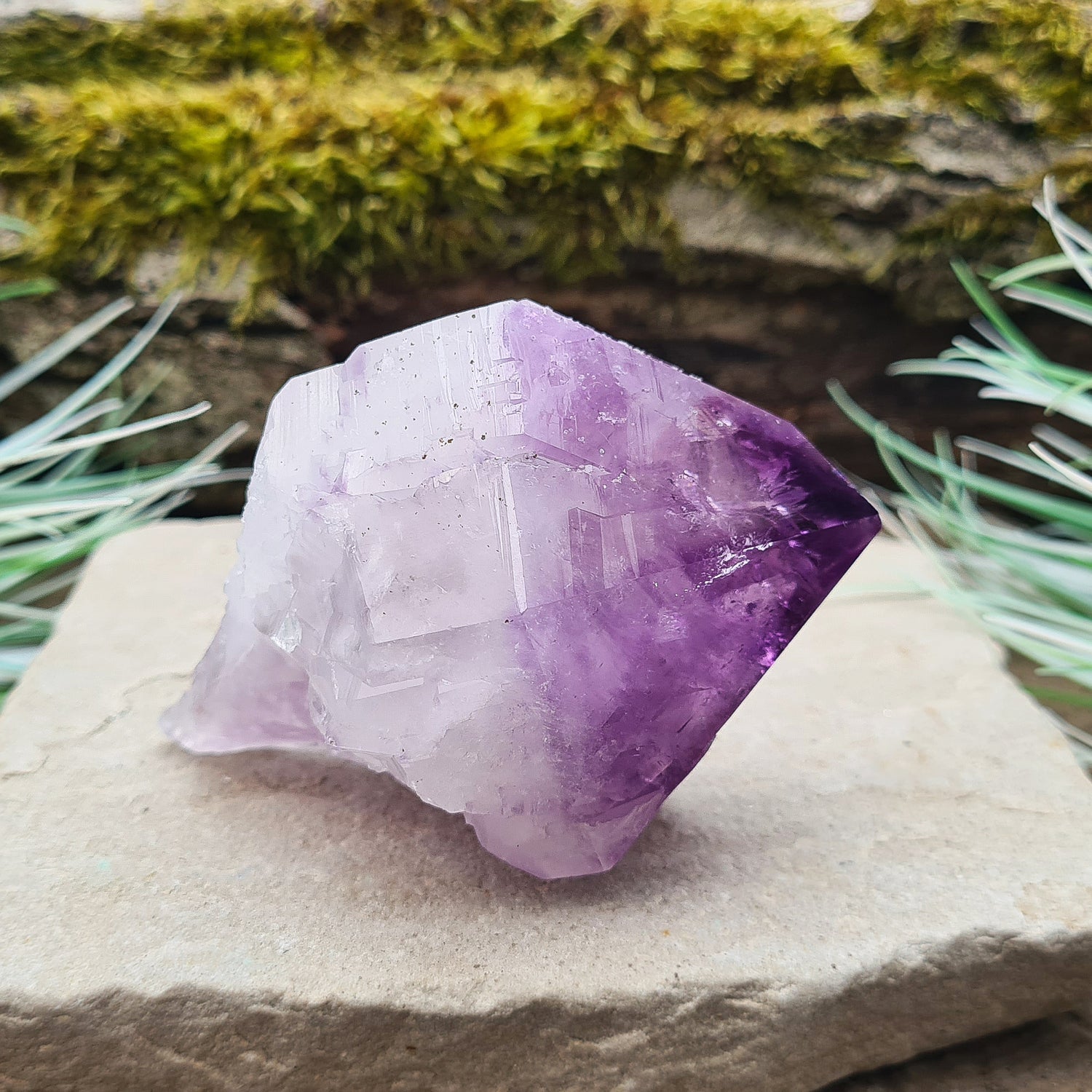 Natural Amethyst Point from Brazil. Has a rainbow in the tip. Fabulous large piece of Amethyst with lovely dark purple colouring, polished point and the rest of the crystal is natural. Also known as an Amethyst Root.