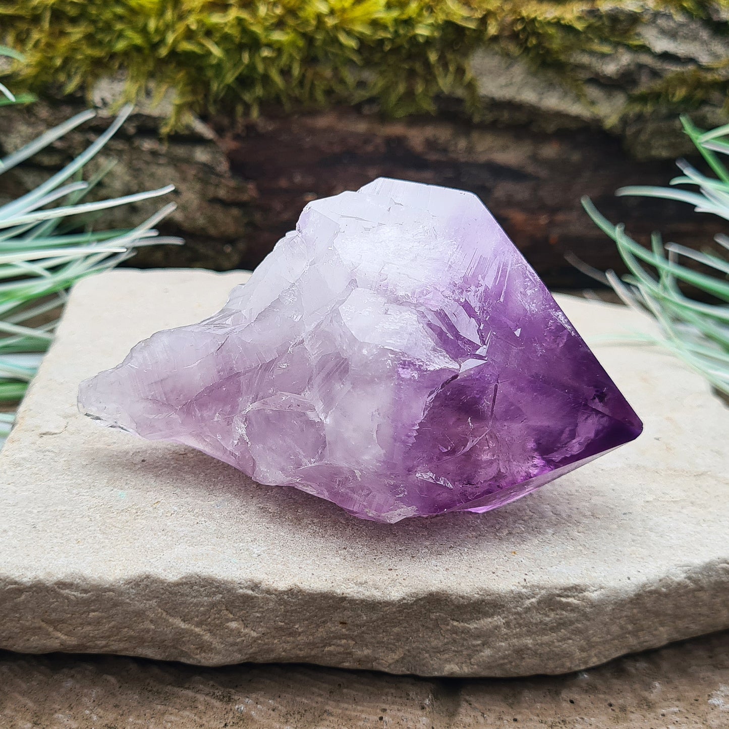 Natural Amethyst Point from Brazil. Has a rainbow in the tip. Fabulous large piece of Amethyst with lovely dark purple colouring, polished point and the rest of the crystal is natural. Also known as an Amethyst Root.