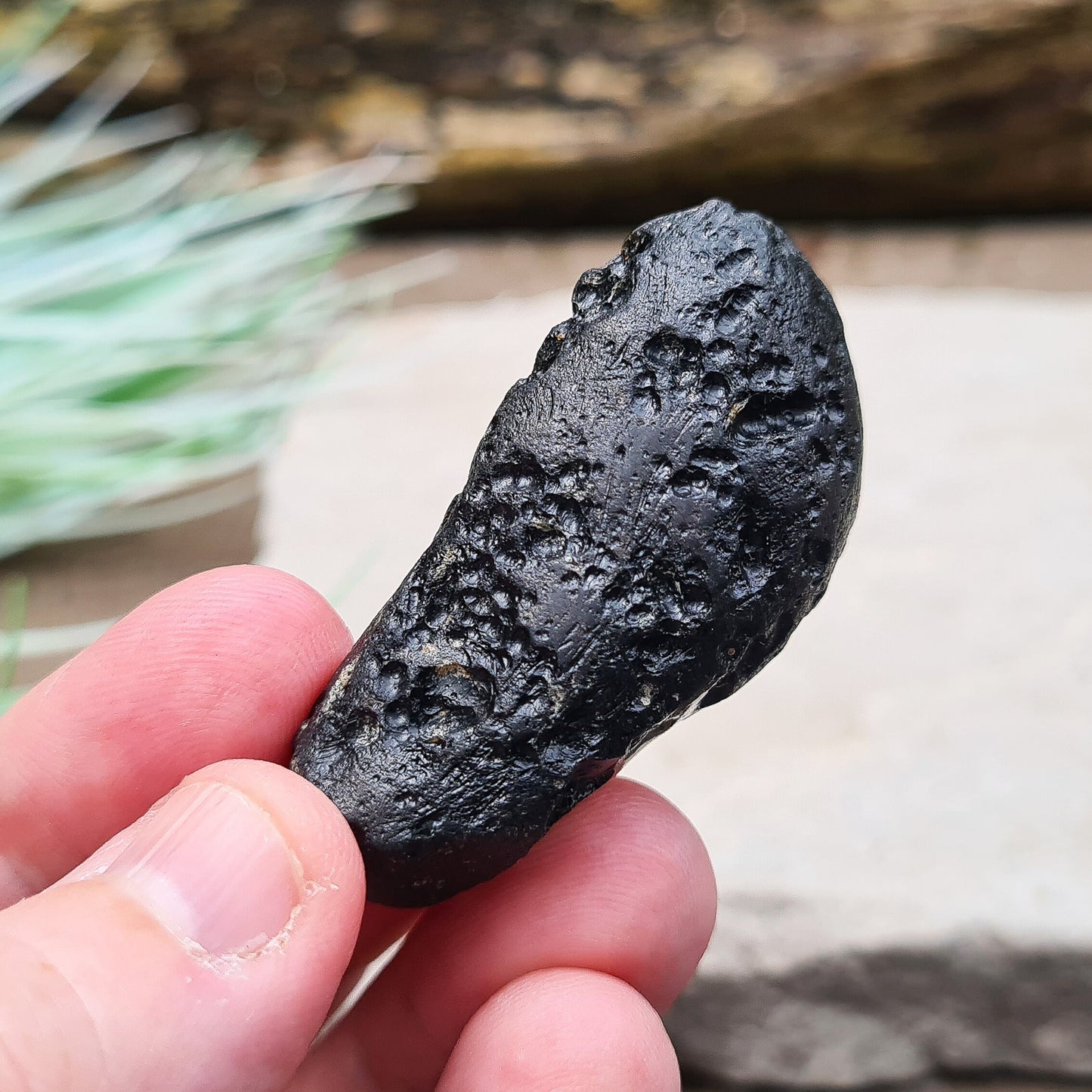 Black Indochinite Tektite, A Grade. A dark black tektite formed from meteorite impact, with a glass-like structure. Estimated to be 700,000 years old, these tektites are found in the Indochinese peninsula, stretching from Australia to China and Indonesia.