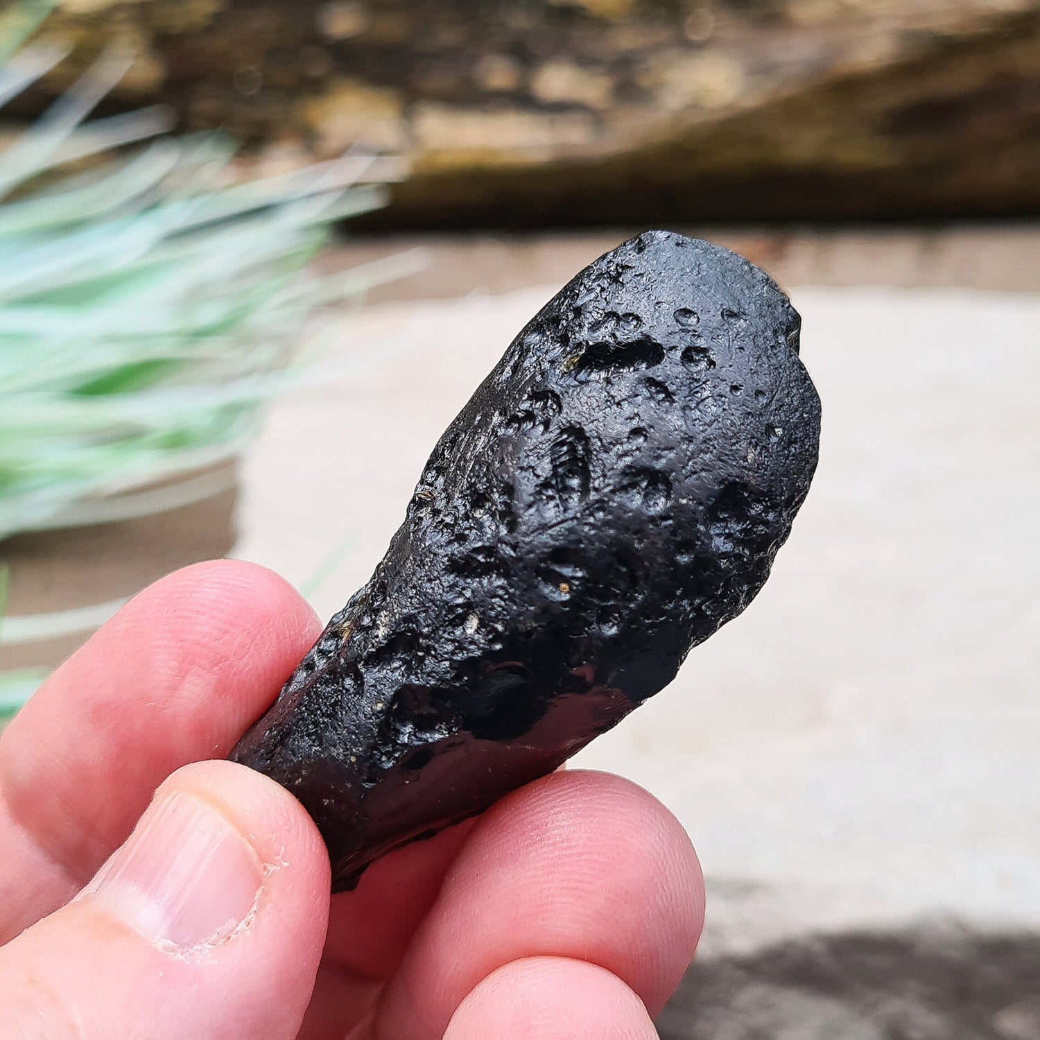 Black Indochinite Tektite, A Grade. A dark black tektite formed from meteorite impact, with a glass-like structure. Estimated to be 700,000 years old, these tektites are found in the Indochinese peninsula, stretching from Australia to China and Indonesia.