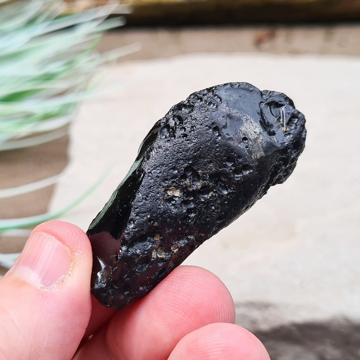 Black Indochinite Tektite, A Grade. A dark black tektite formed from meteorite impact, with a glass-like structure. Estimated to be 700,000 years old, these tektites are found in the Indochinese peninsula, stretching from Australia to China and Indonesia.