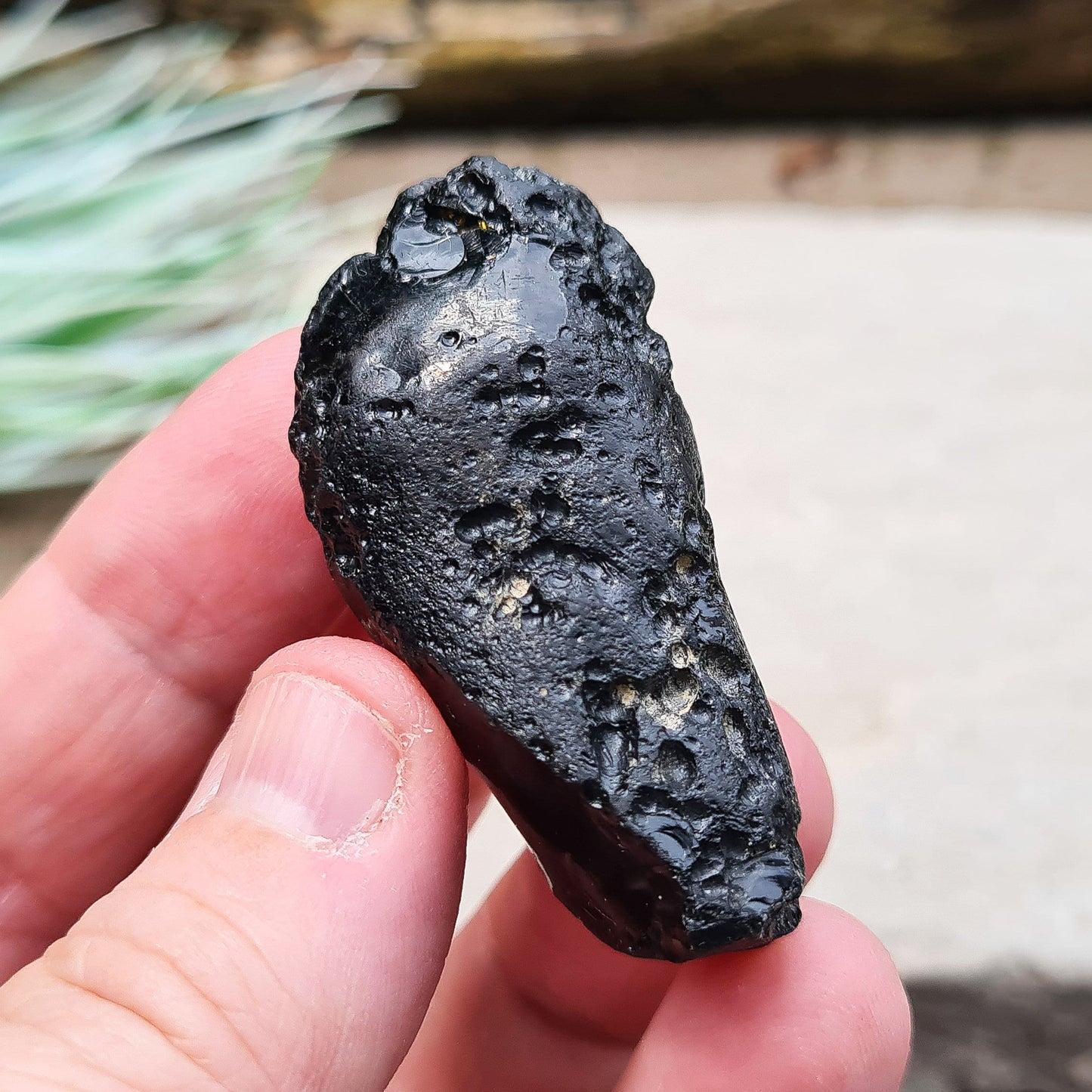 Black Indochinite Tektite, A Grade. A dark black tektite formed from meteorite impact, with a glass-like structure. Estimated to be 700,000 years old, these tektites are found in the Indochinese peninsula, stretching from Australia to China and Indonesia.