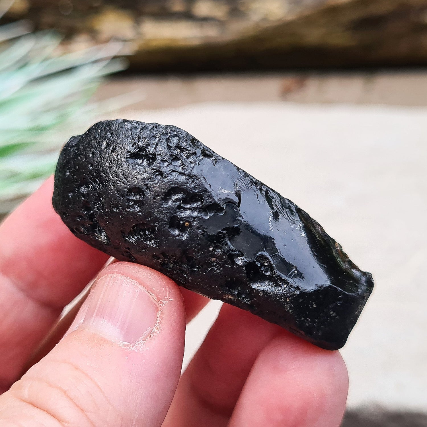 Black Indochinite Tektite, A Grade. A dark black tektite formed from meteorite impact, with a glass-like structure. Estimated to be 700,000 years old, these tektites are found in the Indochinese peninsula, stretching from Australia to China and Indonesia.