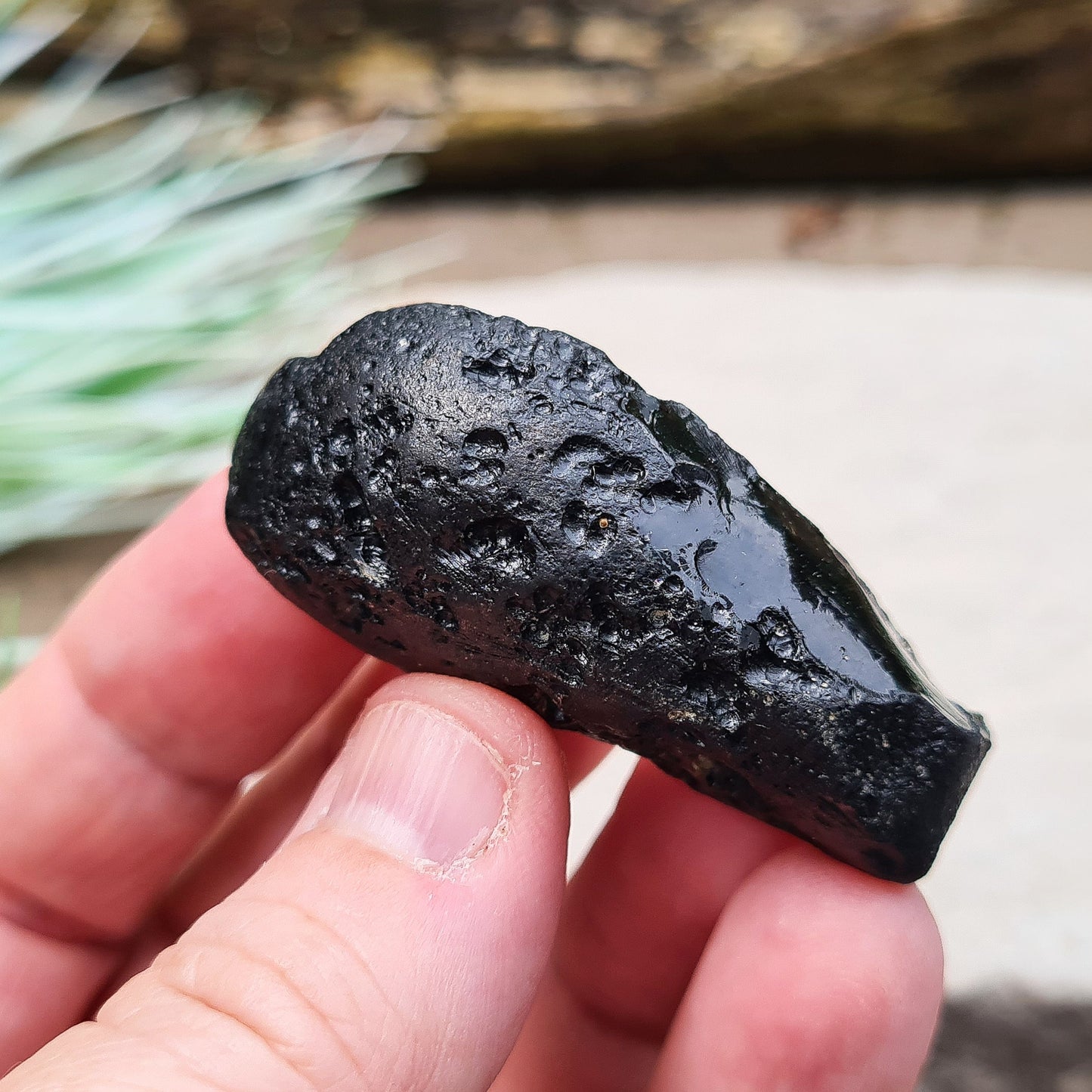 Black Indochinite Tektite, A Grade. A dark black tektite formed from meteorite impact, with a glass-like structure. Estimated to be 700,000 years old, these tektites are found in the Indochinese peninsula, stretching from Australia to China and Indonesia.