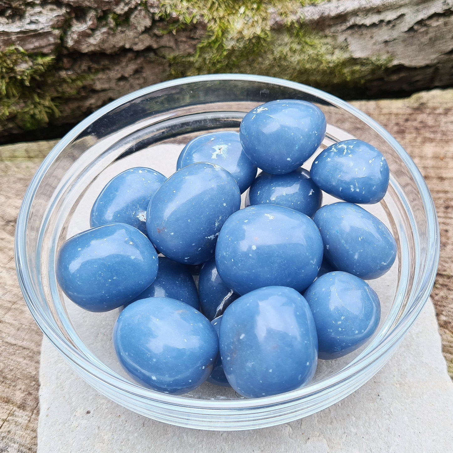 Angelite Crystal Tumble Stones, also known as Angeline or Anhydrite. Angelite is formed from Celestite compressed over millions of years, featuring naturally occurring white flecks of Calcite or Gypsum. Sourced from Peru.