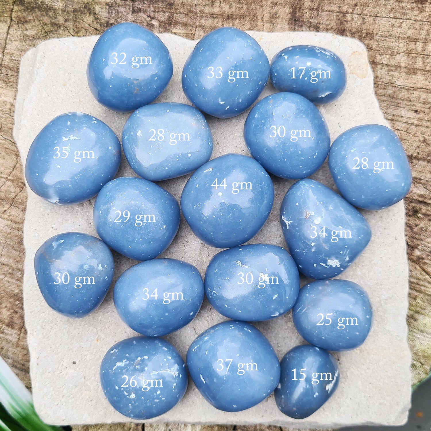 Angelite Crystal Tumble Stones, also known as Angeline or Anhydrite. Angelite is formed from Celestite compressed over millions of years, featuring naturally occurring white flecks of Calcite or Gypsum. Sourced from Peru.