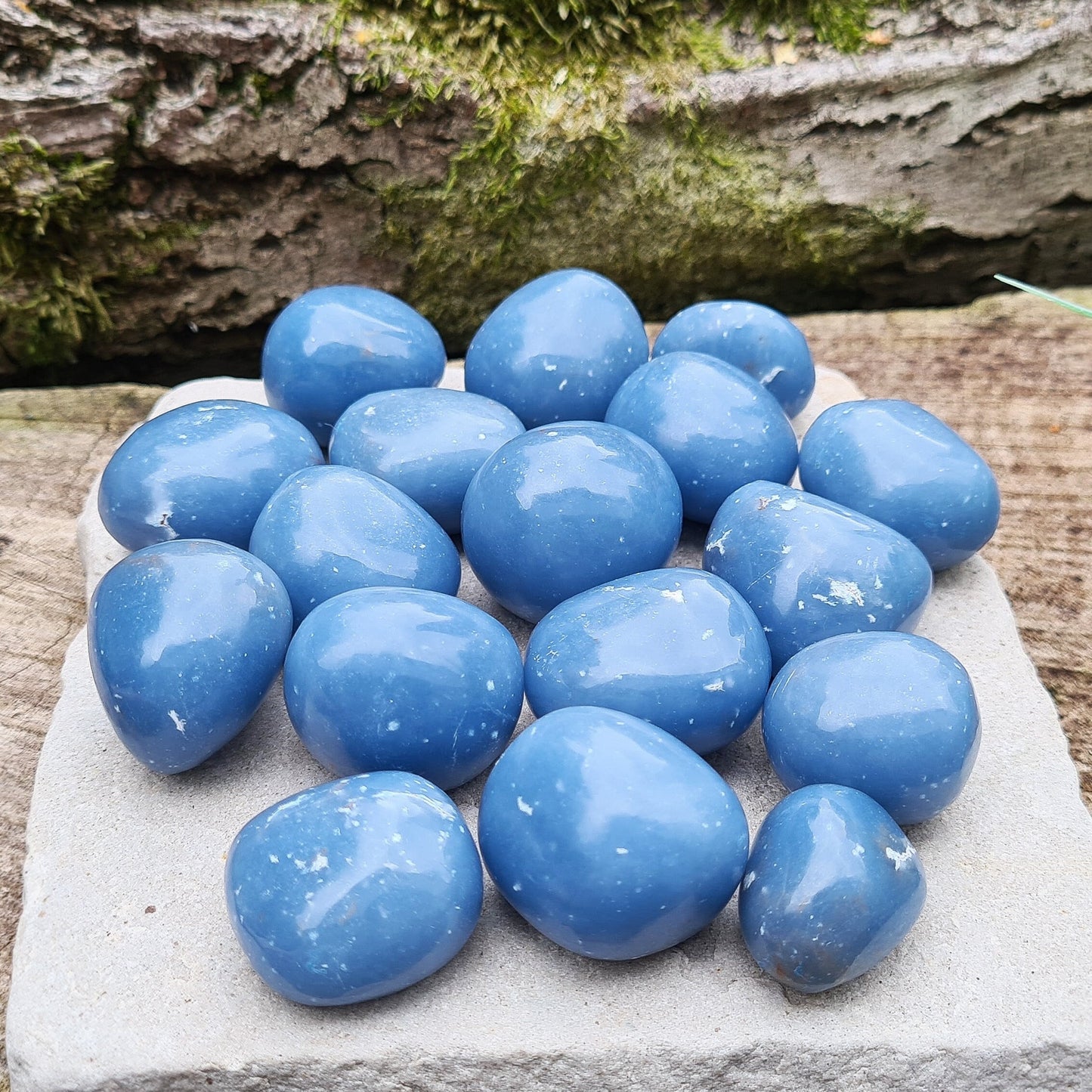 Angelite Crystal Tumble Stones, also known as Angeline or Anhydrite. Angelite is formed from Celestite compressed over millions of years, featuring naturally occurring white flecks of Calcite or Gypsum. Sourced from Peru.