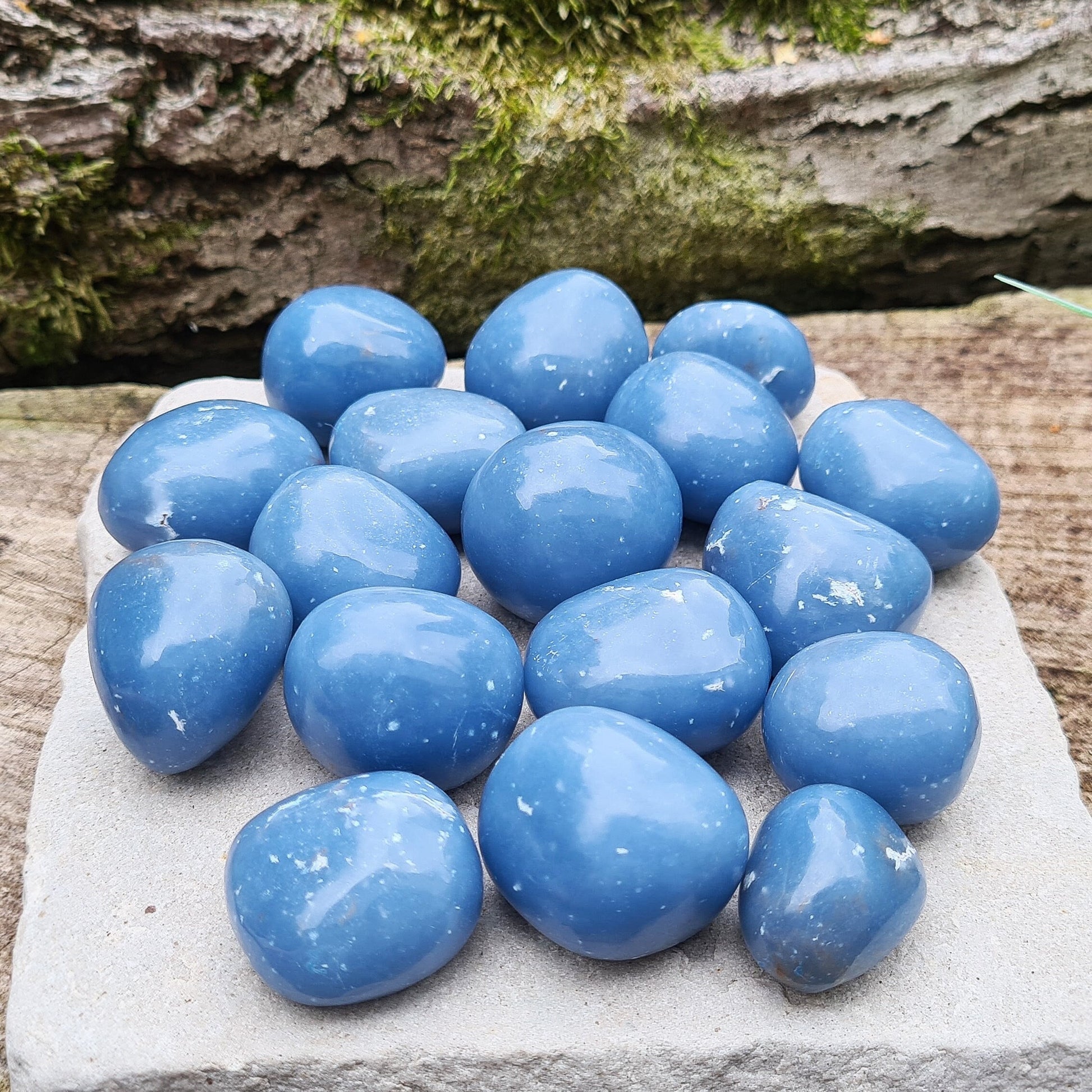 Angelite Extra Large Tumble Stones from Peru feature a soft greyblue tone with natural white flecks of Calcite or Gypsum. Formed from Celestite over millions of years, these soothing stones carry a calming yet grounded presence. Their energy supports communication, compassion, and spiritual connection.