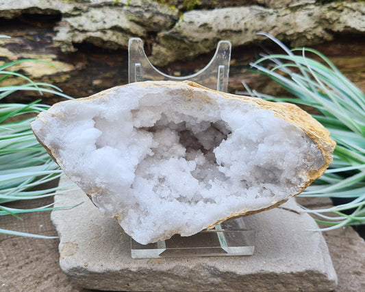 White Quartz Crystal Geode Half, from Morocco. Lovely sparkling white quartz crystal formations. It can sit on its own even if it is at a slight angle on an even surface. I will also provide an acrylic clear stand similar to that in the photos.