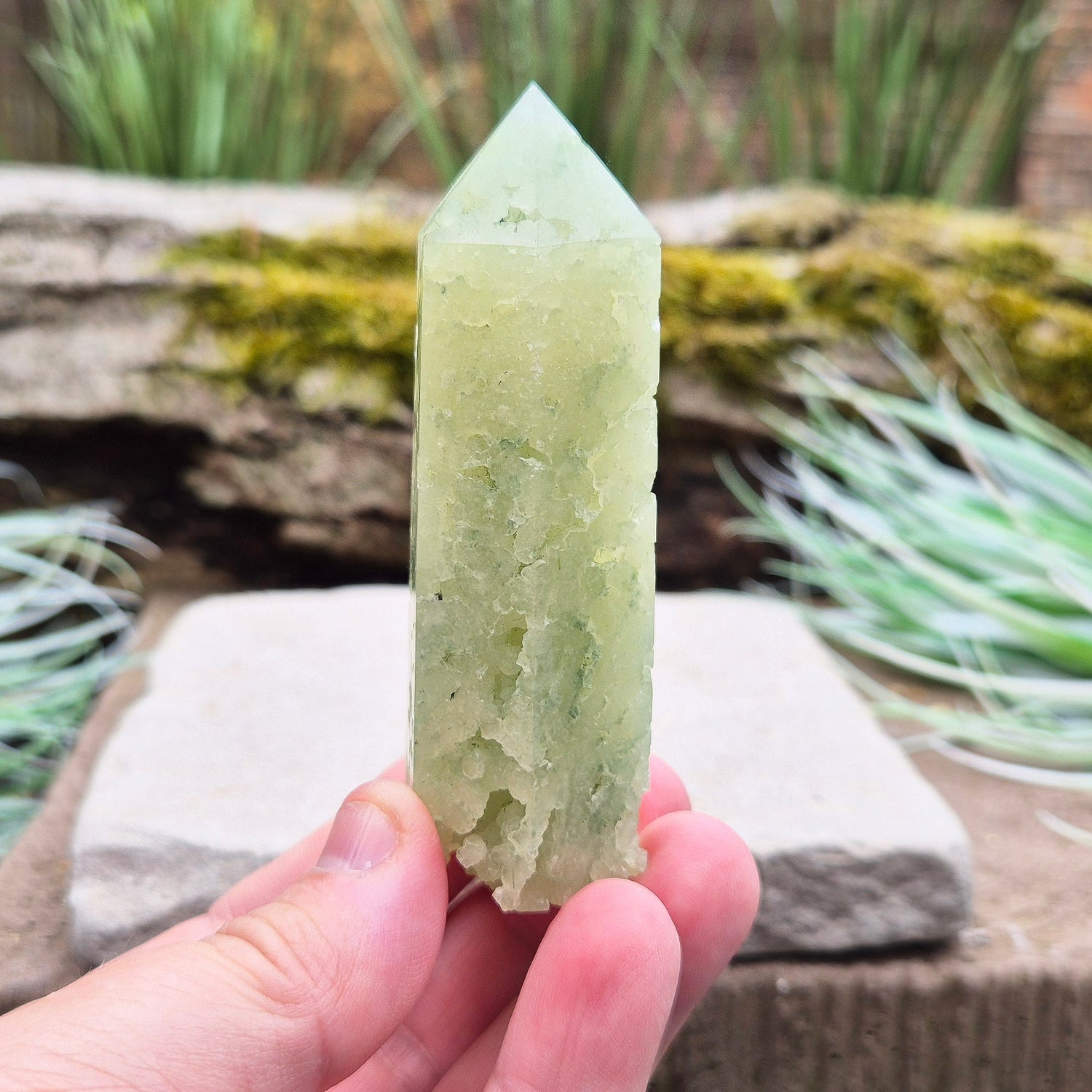 Elevate your space with a Prehnite Crystal Tower, known for promoting peace, healing, and spiritual growth. This serene stone reduces stress and brings harmony.