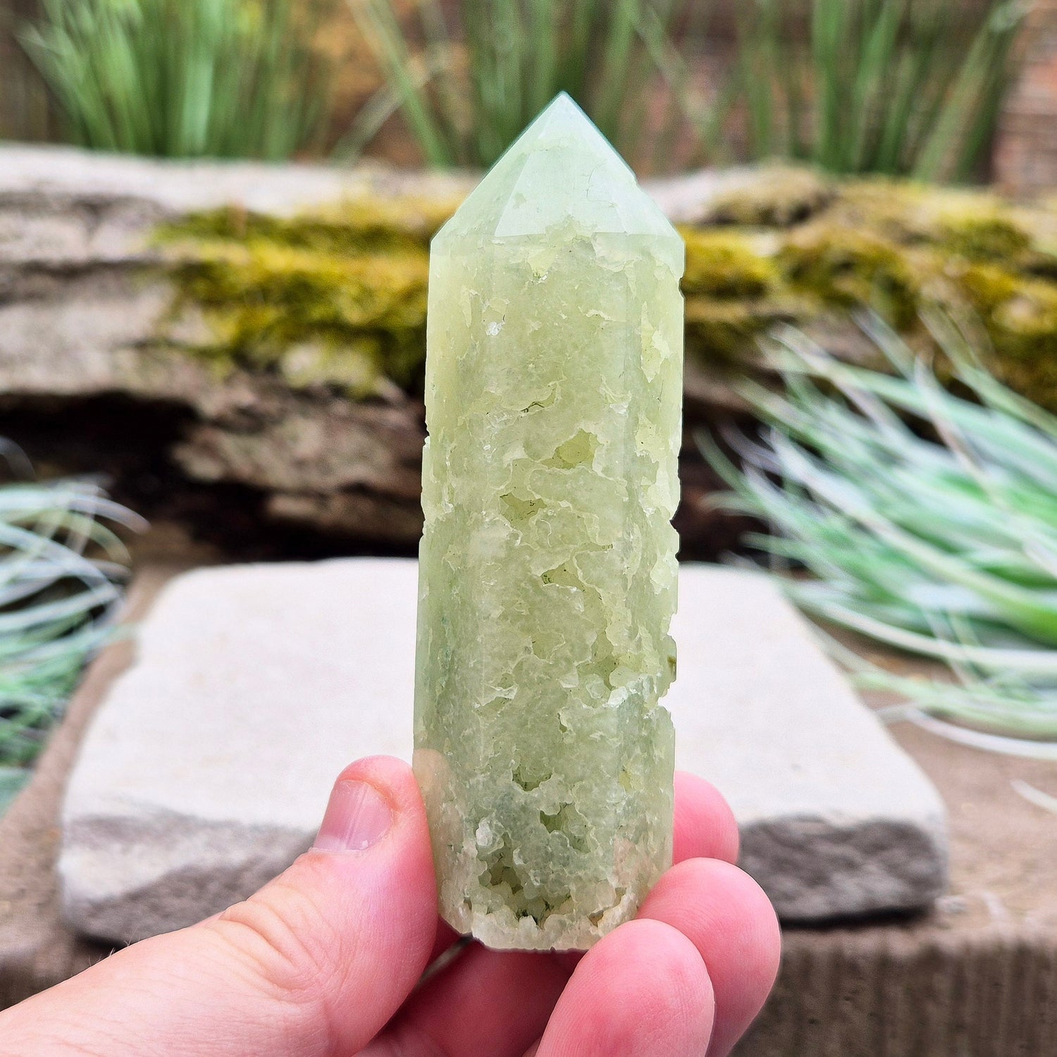 Elevate your space with a Prehnite Crystal Tower, known for promoting peace, healing, and spiritual growth. This serene stone reduces stress and brings harmony.