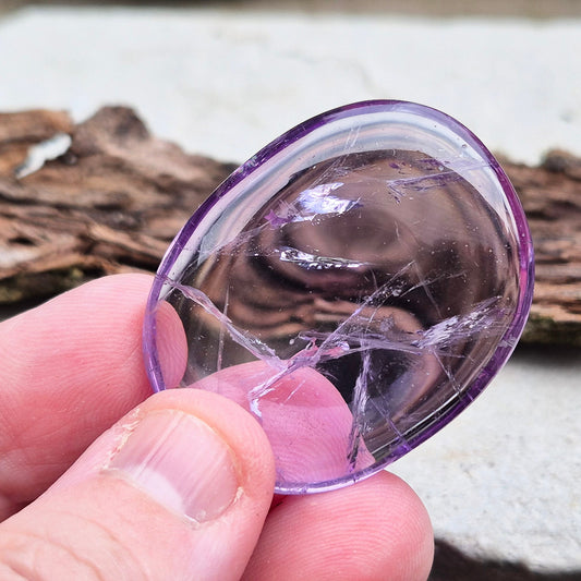 Transparent Amethyst Crystal Palm Stone, A Grade, from Brazil. Lovely quality palm stone which has light reflecting inclusions and I have seen a rainbow on its side.