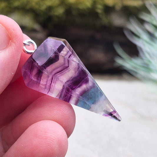 Fluorite Crystal Pendulum. Colour is green, purple and clear, tip is intact. Will come in a box or organza pouch to keep it in.