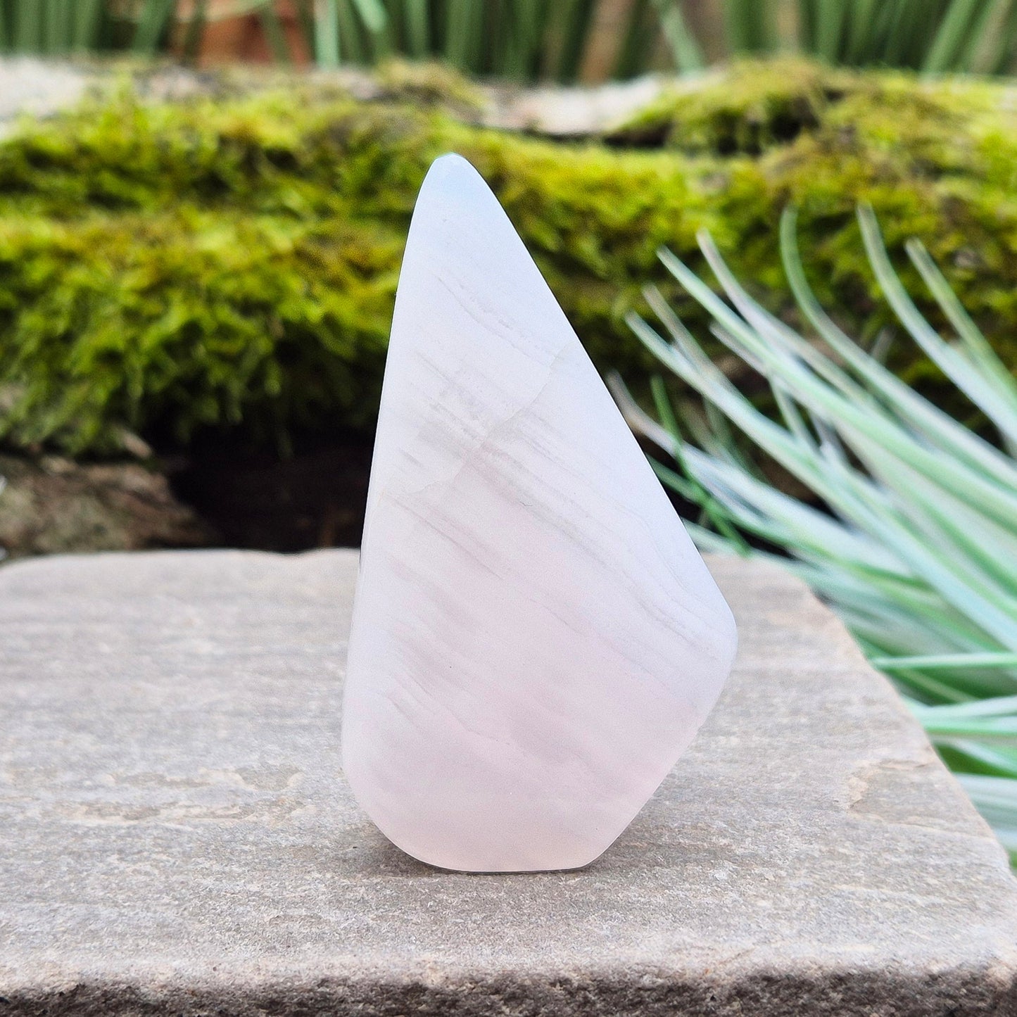 Mangano Calcite Crystal Free Form, Polished, does have the visible stripy banding which does not always show up in the photos of videos. Also known as Pink Calcite.