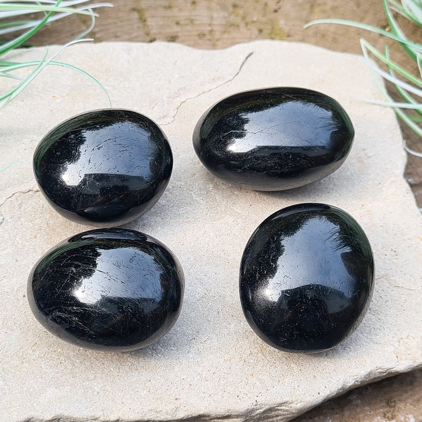 Polished Black Tourmaline crystal from Brazil. Really lovely polished pieces of Black Tourmaline with a shiny lustre. Black Tourmaline is also known as Schorl. Oval shaped.