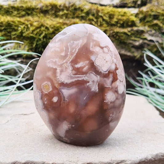 Cherry Blossom Agate Crystal Free Form, also known as Blossom Agate or Flower Agate, is a beautiful variety of Pink Chalcedony that originates from Madagascar. This stone is recognized for its distinctive, flower-like patterns that resemble blooming blossoms