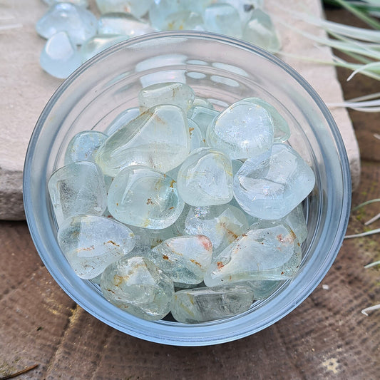 Blue Topaz Tumble Stones, A grade Blue Topaz, most are clear, a few are a little milky, all with small specks of Hematite inclusions, sparkly and some have rainbows. 