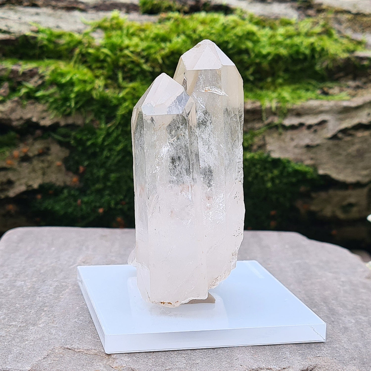 Madagascan Quartz Crystal Cluster with 2 points growing along side each other, I will include a clear acrylic stand and some tac so you can stand it up.