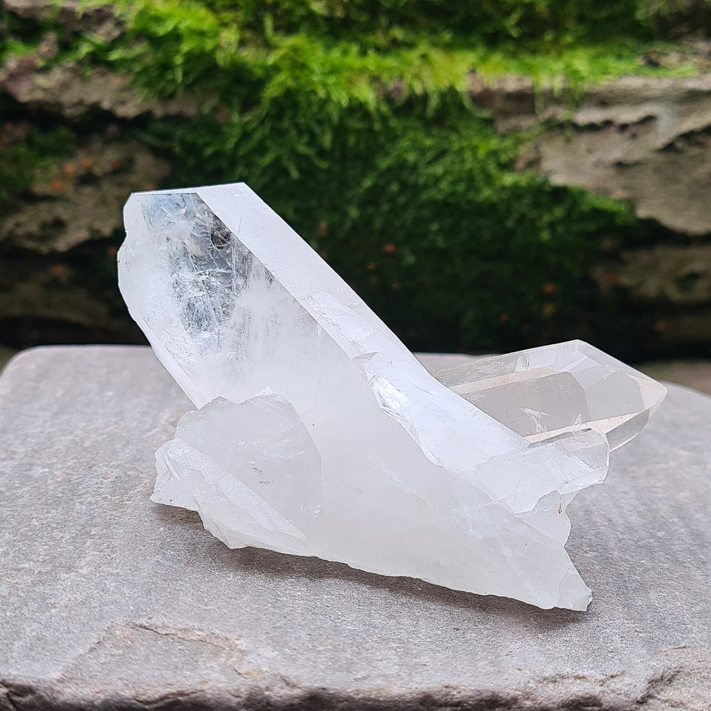 Madagascan Quartz Crystal Cluster with 2 points growing in a cross like formation and a smaller point. This crystal will self stand.