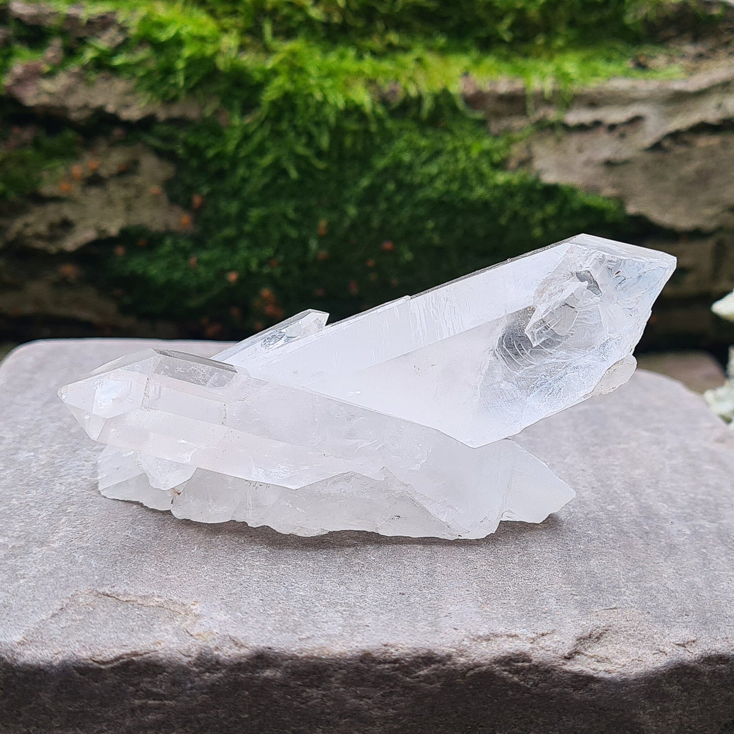 Madagascan Quartz Crystal Cluster with 2 points growing in a cross like formation and a smaller point. This crystal will self stand.