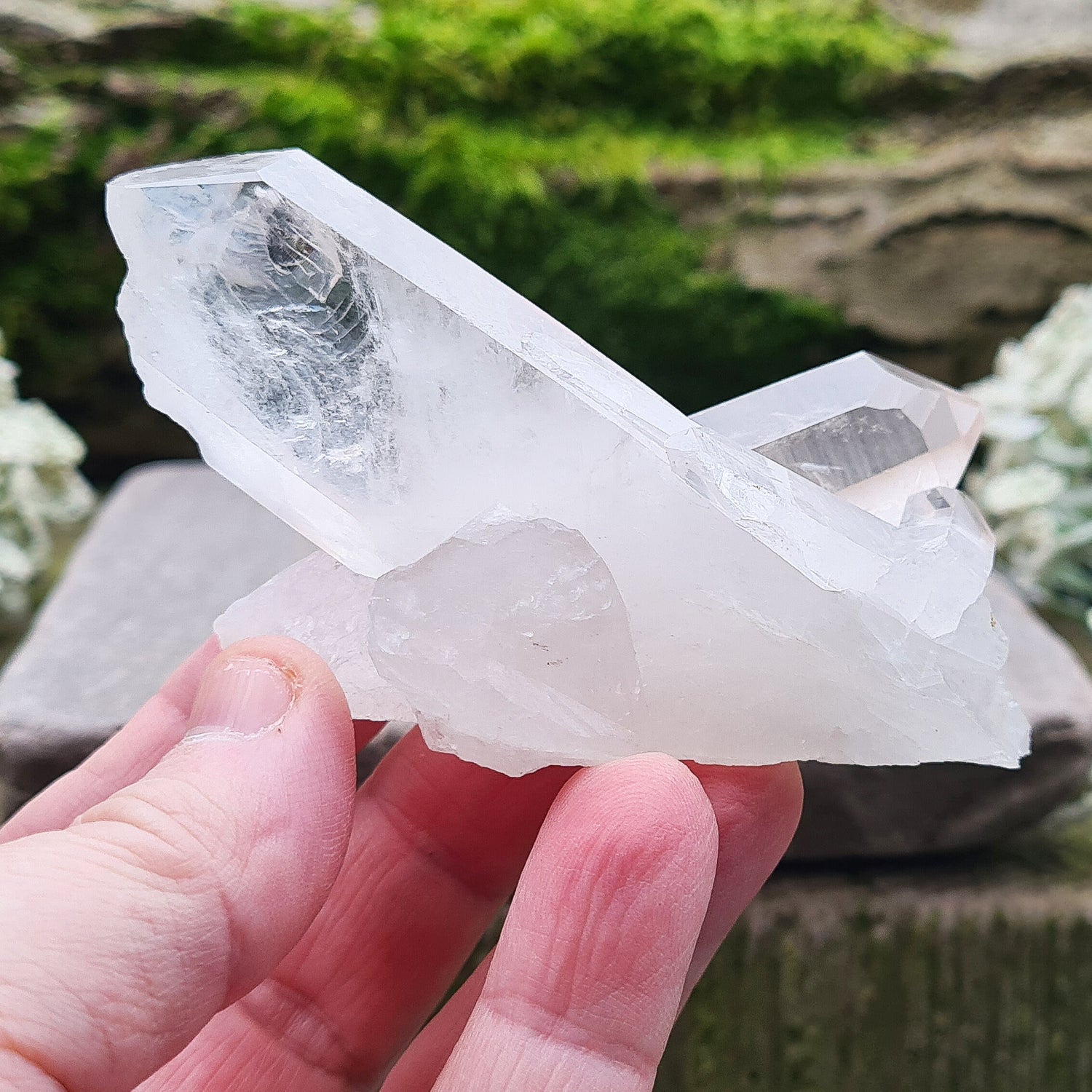 Madagascan Quartz Crystal Cluster with 2 points growing in a cross like formation and a smaller point. This crystal will self stand.