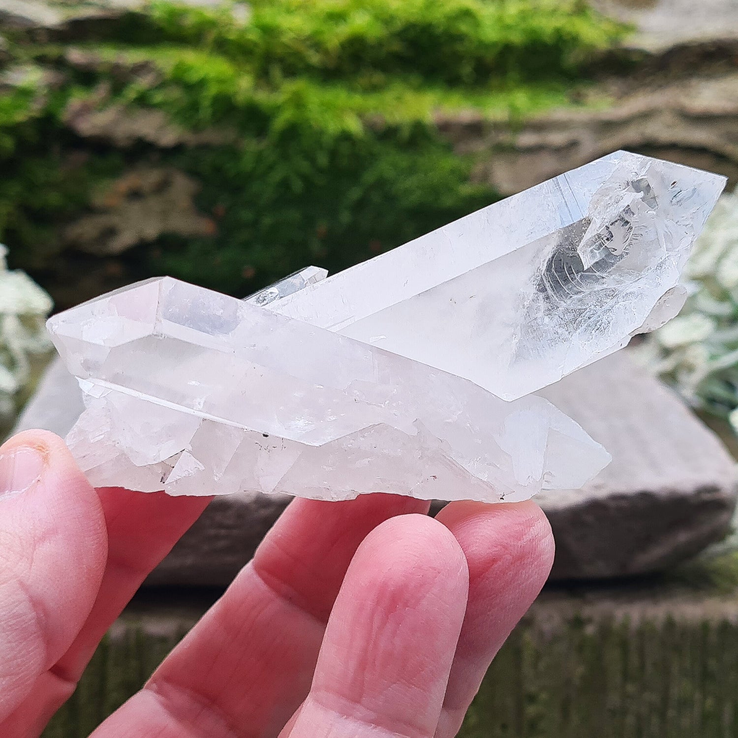 Madagascan Quartz Crystal Cluster with 2 points growing in a cross like formation and a smaller point. This crystal will self stand.