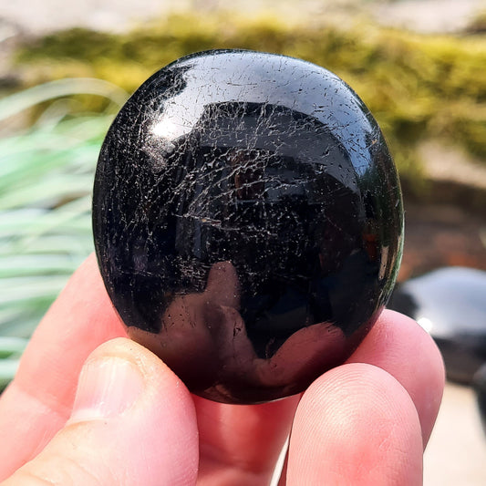 Polished Black Tourmaline crystal from Brazil. Really lovely polished pieces of Black Tourmaline with a shiny lustre. Black Tourmaline is also known as Schorl. Oval shaped.