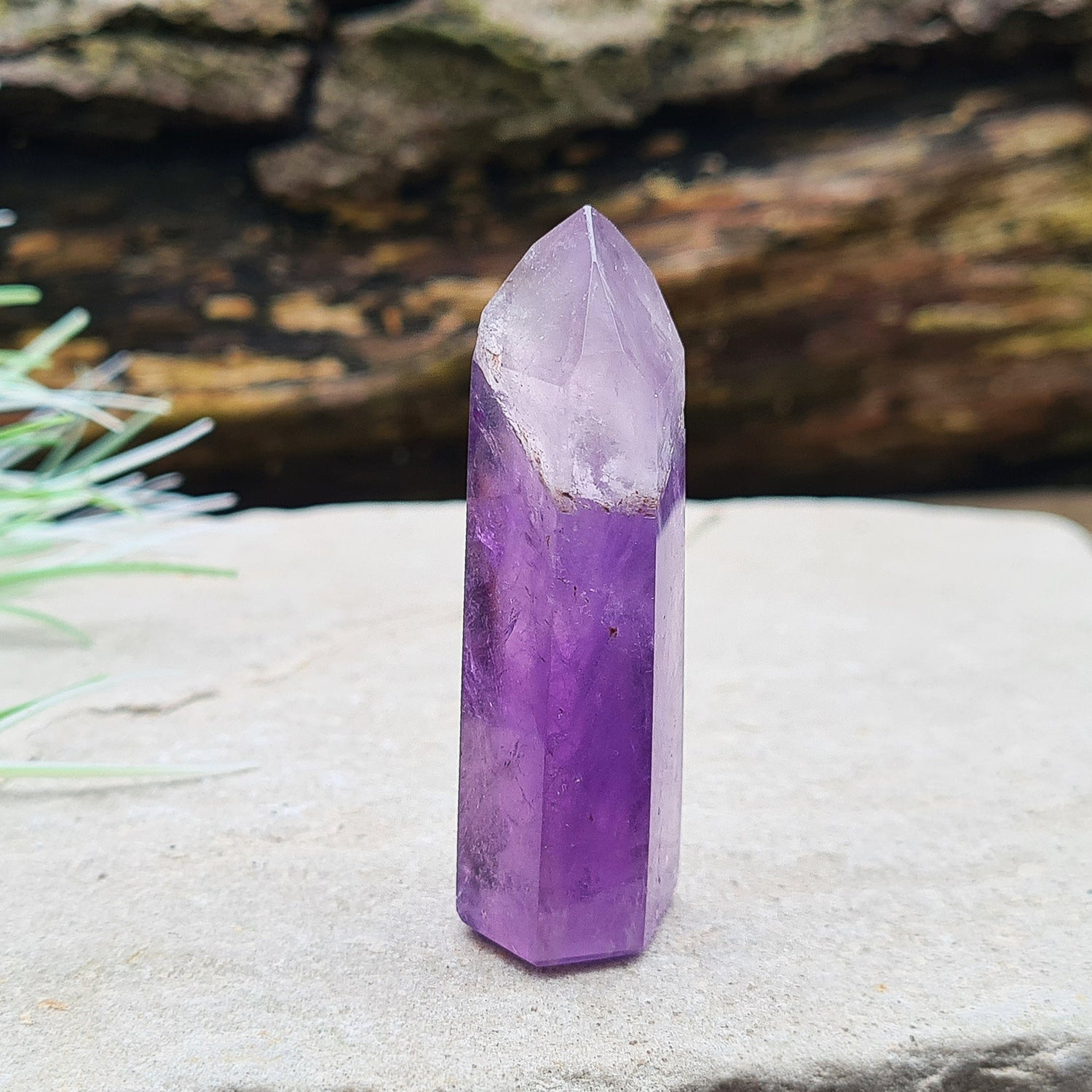 Amethyst Tower from Brazil. This is a great polished crystal with lovely purple colouring and at the top is a very pale lavender/white colouring.