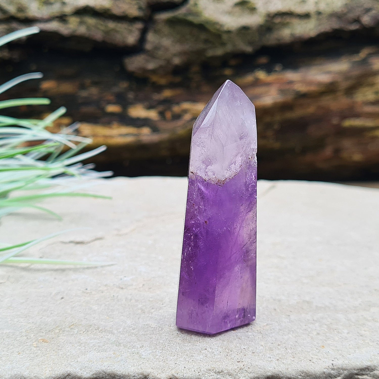 Amethyst Tower from Brazil. This is a great polished crystal with lovely purple colouring and at the top is a very pale lavender/white colouring.