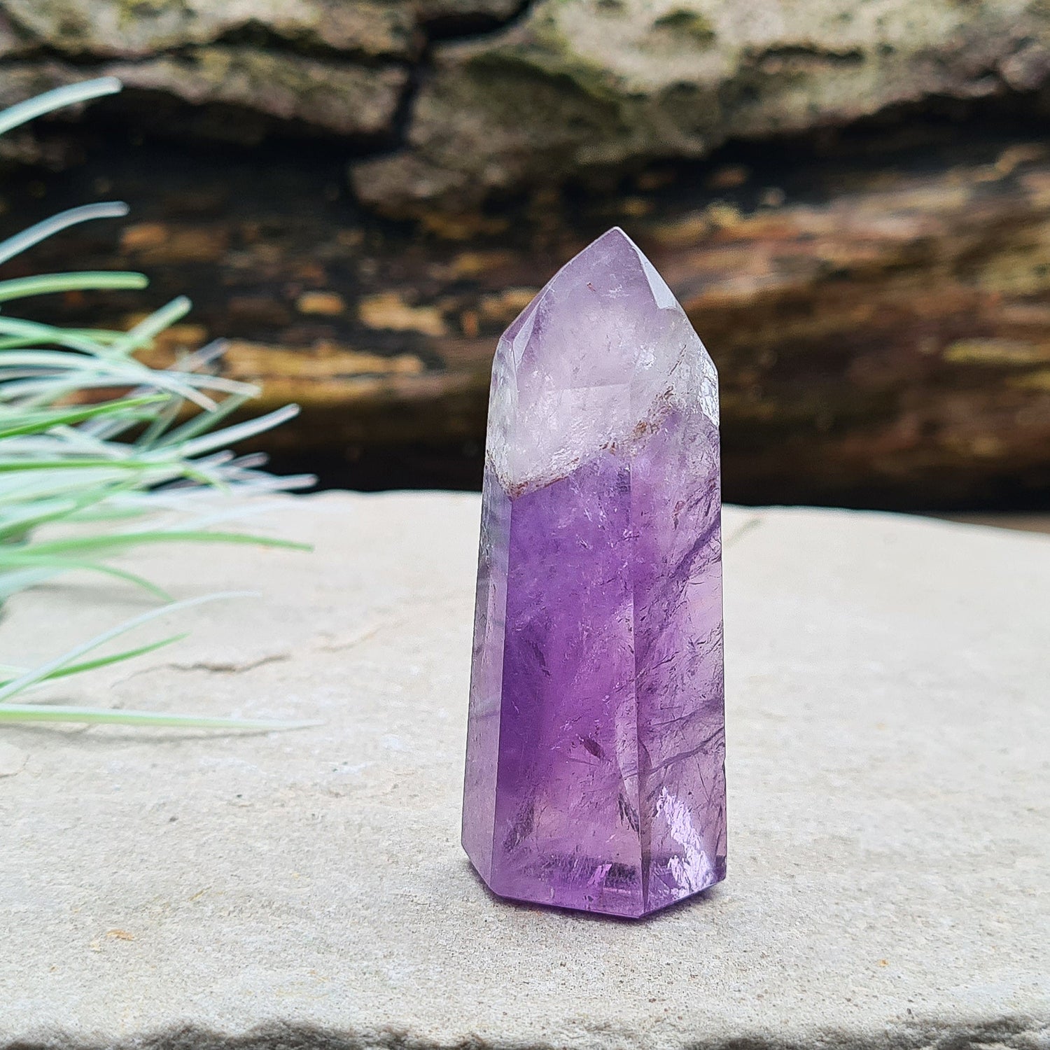 Amethyst Tower from Brazil. This is a great polished crystal with lovely purple colouring and at the top is a very pale lavender/white colouring.