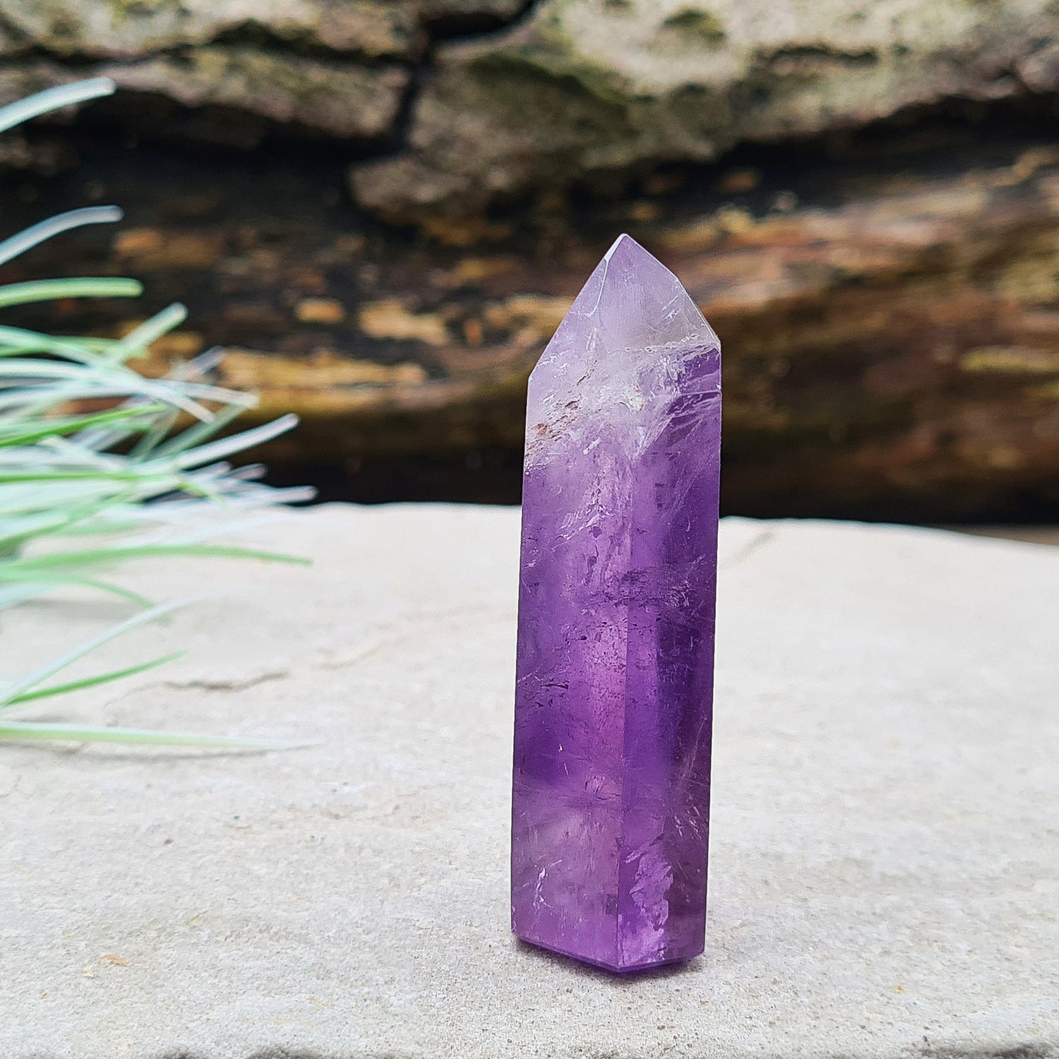 Amethyst Tower from Brazil. This is a great polished crystal with lovely purple colouring and at the top is a very pale lavender/white colouring.