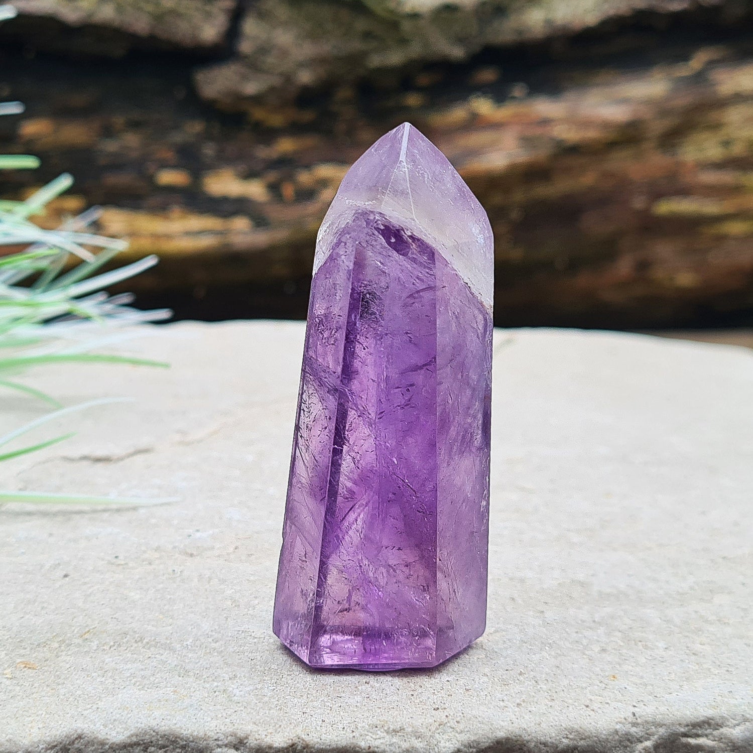 Amethyst Tower from Brazil. This is a great polished crystal with lovely purple colouring and at the top is a very pale lavender/white colouring.