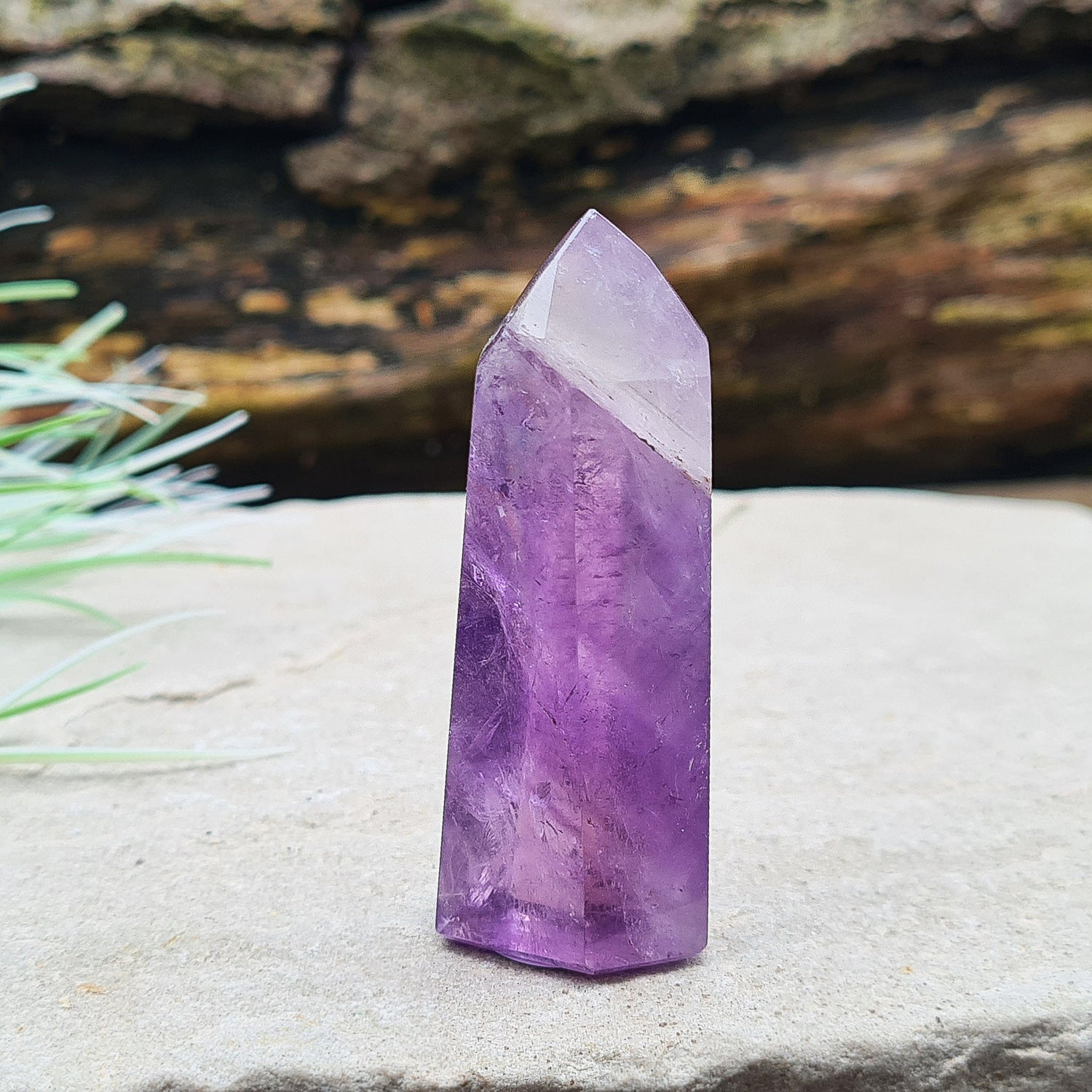 Amethyst Tower from Brazil. This is a great polished crystal with lovely purple colouring and at the top is a very pale lavender/white colouring.