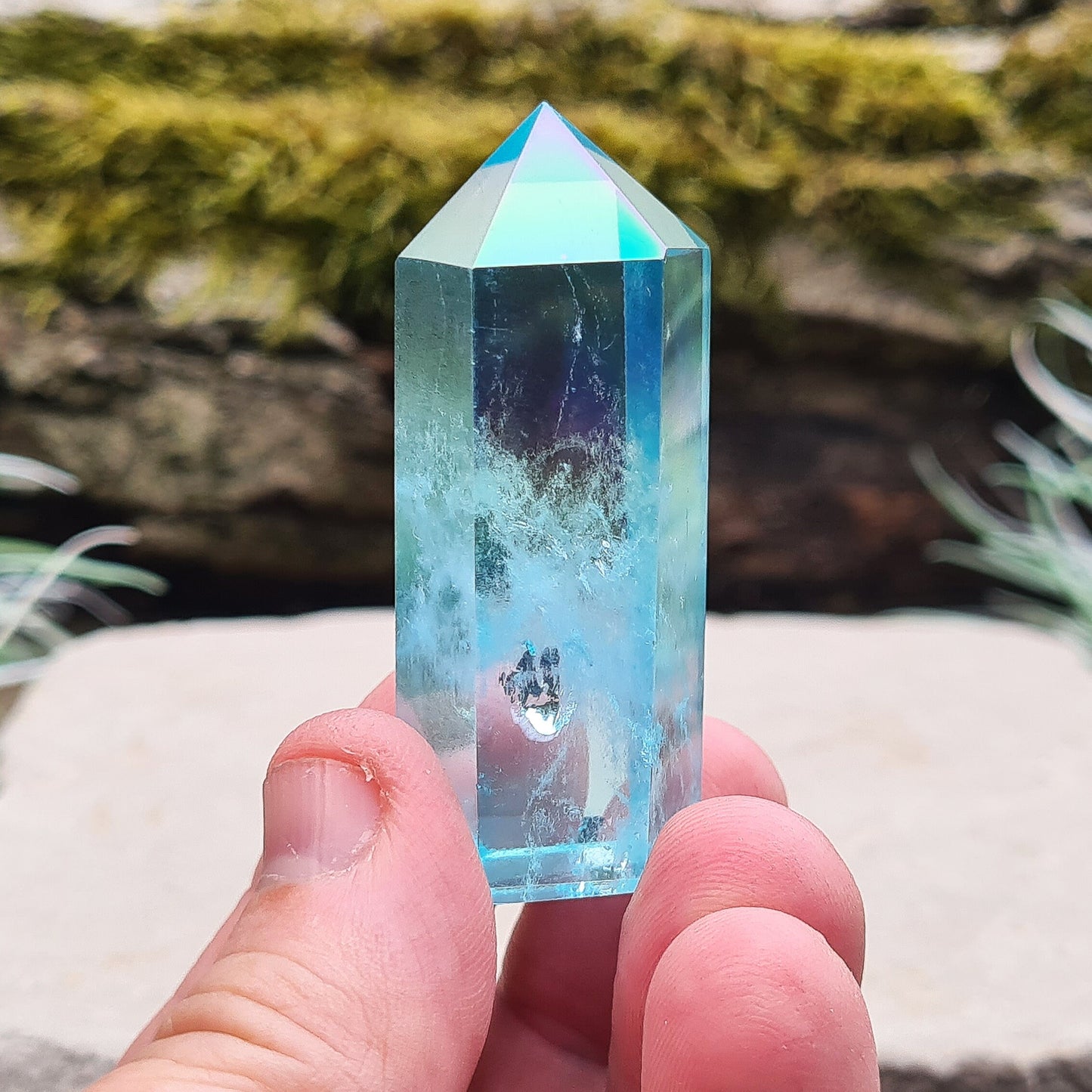 Aqua Aura Quartz Crystal Standing Point from Brazil. Tip is a 6 sided generator point and it has light reflecting inclusions.