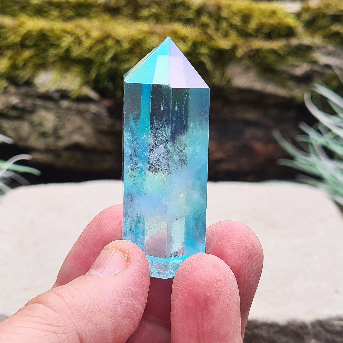 Aqua Aura Quartz Crystal Standing Point from Brazil. Tip is a 6 sided generator point and it has light reflecting inclusions.