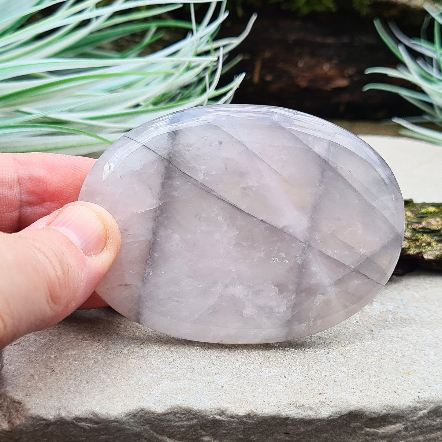 Lunar Quartz Crystal or Lunar Rose Quartz Crystal Palm Stone is from one source in Namibia. It is an infusion of Rose Quartz and Graphite 